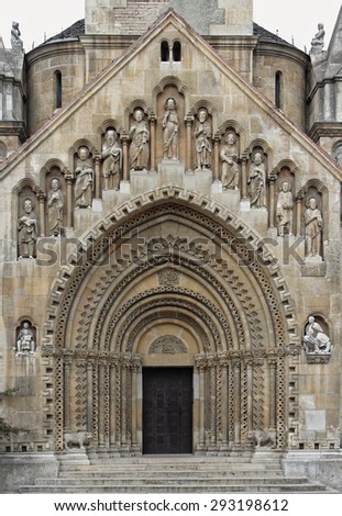 Gothic church door and stone-carved sculptures.