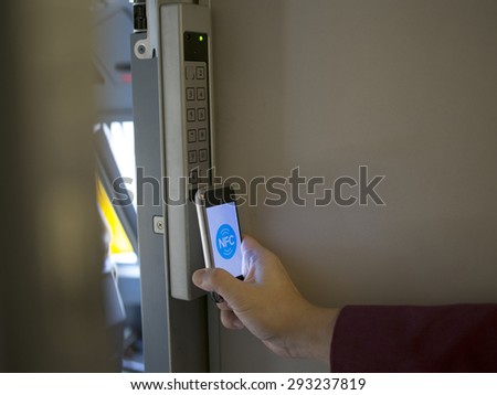 nfc's mobile phone use for open safety door Royalty-Free Stock Photo #293237819