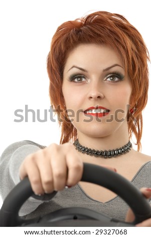The smiling young woman at the wheel an autosimulator, isolated
