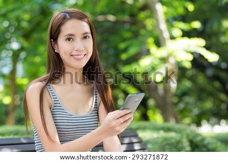 Young woman use of cellphone at outdoor