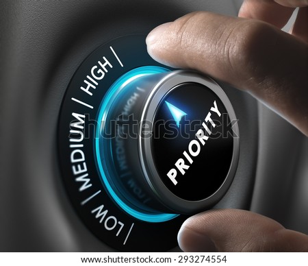 Man fingers setting priority button on highest position. Concept image for illustration of priorities management. Royalty-Free Stock Photo #293274554