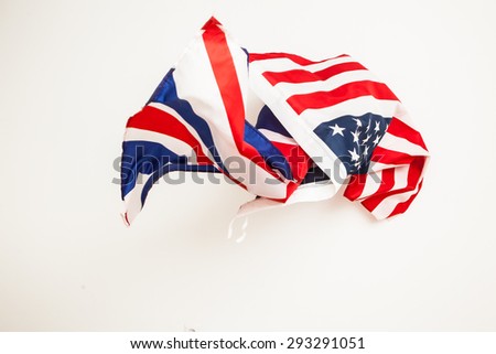 The fall of the USA and Great Britain. Falling flags of the two countries.