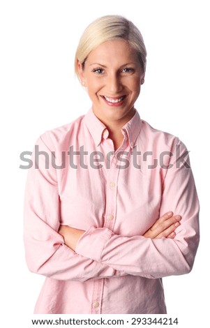 A cute woman with blonde hair in her 20s, standing against a white background in a pink shirt feeling great and confident.