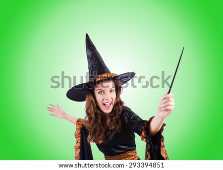 Witch with wand against the gradient 