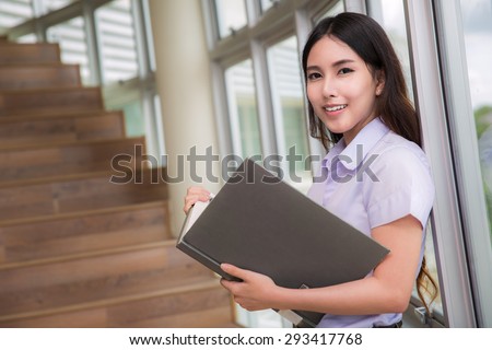 Asia students read a book in Library Royalty-Free Stock Photo #293417768