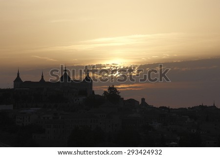 Dawn in Toledo, Castilla La Mancha,Spain, backlit, yellow background and black silhouette sky over the city silhouette view of the main medieval monuments,creative photographs of Munimara,munimara.com