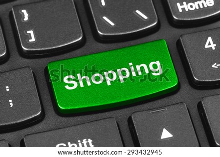 Computer notebook keyboard with Shopping key - technology background