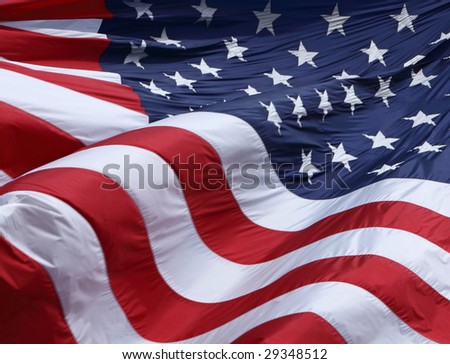 Picture of a large American flag waving in the wind