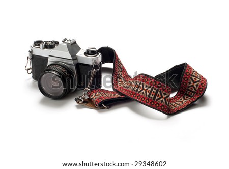 A classic 35mm film camera isolated on white. Royalty-Free Stock Photo #29348602