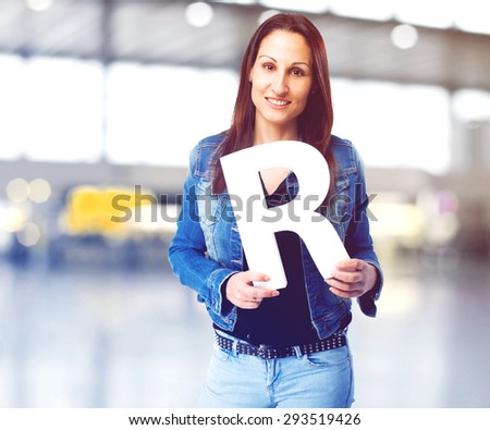woman holding the R letter