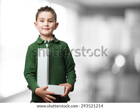 little kid holding the l letter