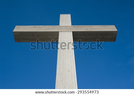 Catholic cross on the blue sky background
