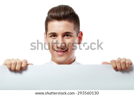 Potrait of a young man holding blank billboard