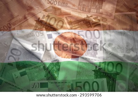 colorful waving niger flag on a euro money background