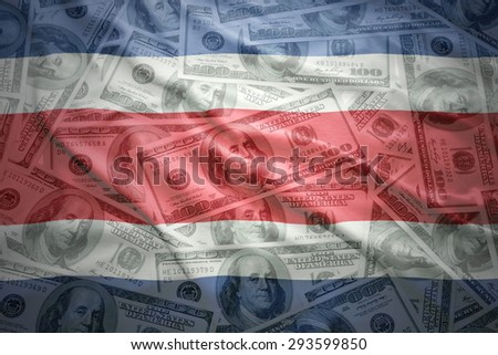 colorful waving costa rican flag on a american dollar money background