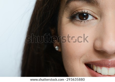 face close-up of beautiful young ethnic woman with black eyes