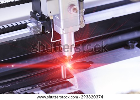 High precision CNC laser cutting metal sheet Royalty-Free Stock Photo #293820374