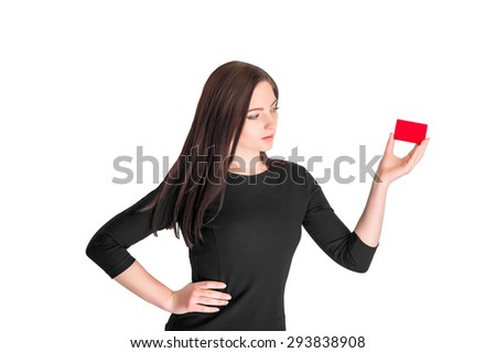 Close-up portrait of young pretty business woman holding red credit card isolated on white background