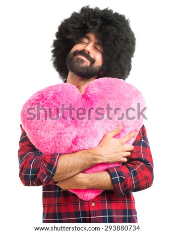 Afro man holding a big heart