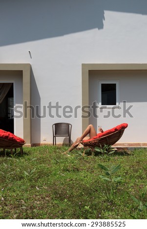 Natural light photo. Large backyard with a lawn and chairs, concept of summer vacations, relaxation and sunbathing, view 2