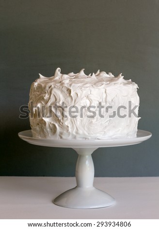 White cake on stand with gray background, vertical Royalty-Free Stock Photo #293934806