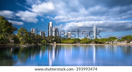 Beautifully Dramatic Daytime Long Exposure View of the Gold Coast Skyline Reflecting in the Canal with a Park on a Sunny Day, Surfers Paradise, Queensland, Australia