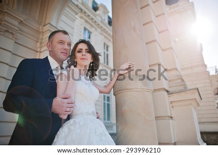wedding couple on background of great historical palace