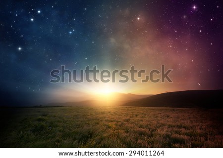 Beautiful sunrise with stars and galaxy in night sky. Royalty-Free Stock Photo #294011264