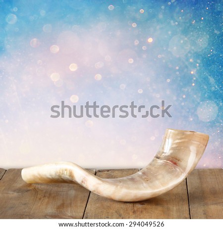shofar (horn) on wooden table. rosh hashanah (jewish holiday) concept . traditional holiday symbol.
 Royalty-Free Stock Photo #294049526