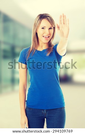 Young woman making stop sign