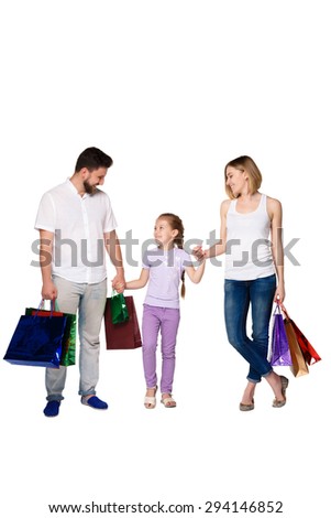 Happy family with shopping bags standing at studio, isolated on white background