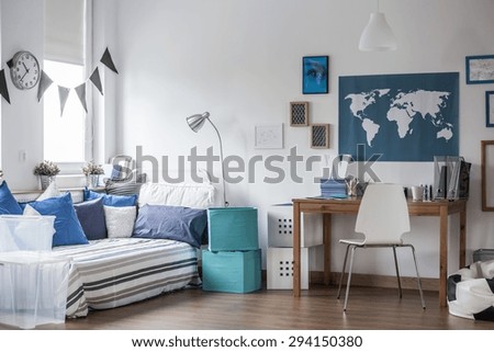 Horizontal view of designed teenage boy room Royalty-Free Stock Photo #294150380