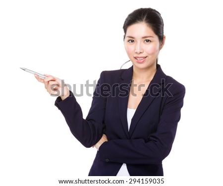Young Businesswoman showing pen point aside