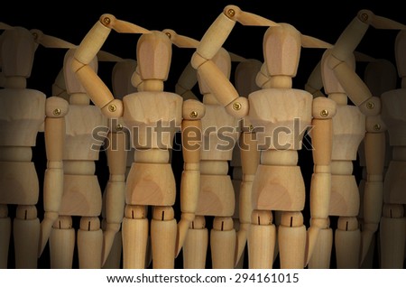 group of wooden puppets on a black background