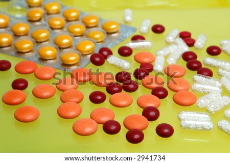 Some pills in yellow background