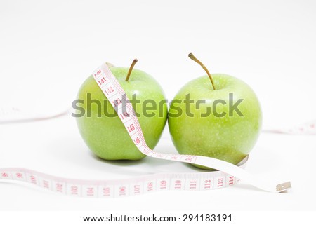 Green apple with measurement isolated on white