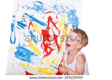 Little boy painting on canvas. Education. Creativity. Studio portrait over white background
