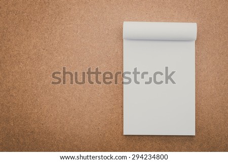 White paper mock up on wood background - vintage filter