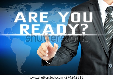 Businessman hand touching ARE YOU READY? message on virtual screen