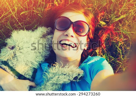 young woman taking selfie with her dog
 Royalty-Free Stock Photo #294273260