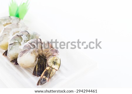 Picture of frozen prawns on white background