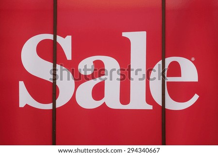 The word "Sale" on a show window