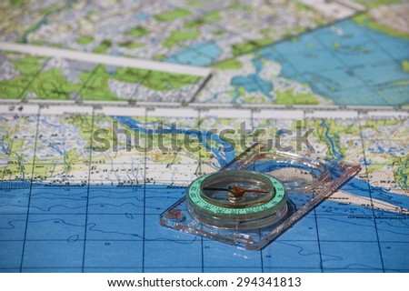 Magnetic compass and topographic maps.