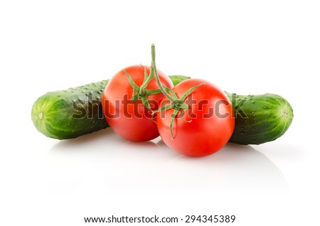 Fresh Tomatoes and Cucumbers isolated on white background