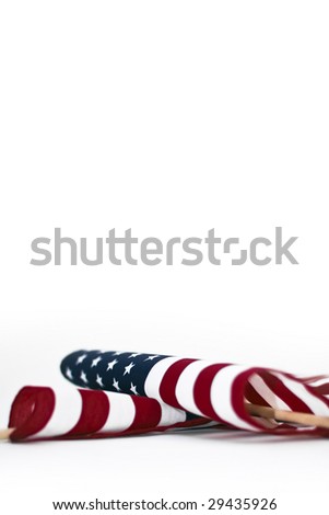 American flag laying down on white background