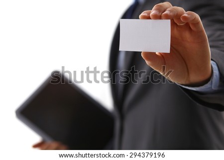 Hand of a businessman with a business card