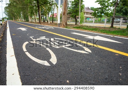 Bicycle road sign on asphalt.