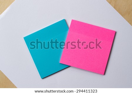 blue and pink sticker paper note on white paper