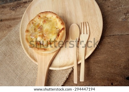 Crispy homemade Pizza on background of brown.