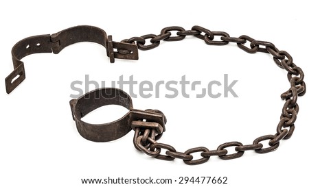 Old chains or shackles used for locking up prisoners or slaves between 1600 and 1800.  Royalty-Free Stock Photo #294477662